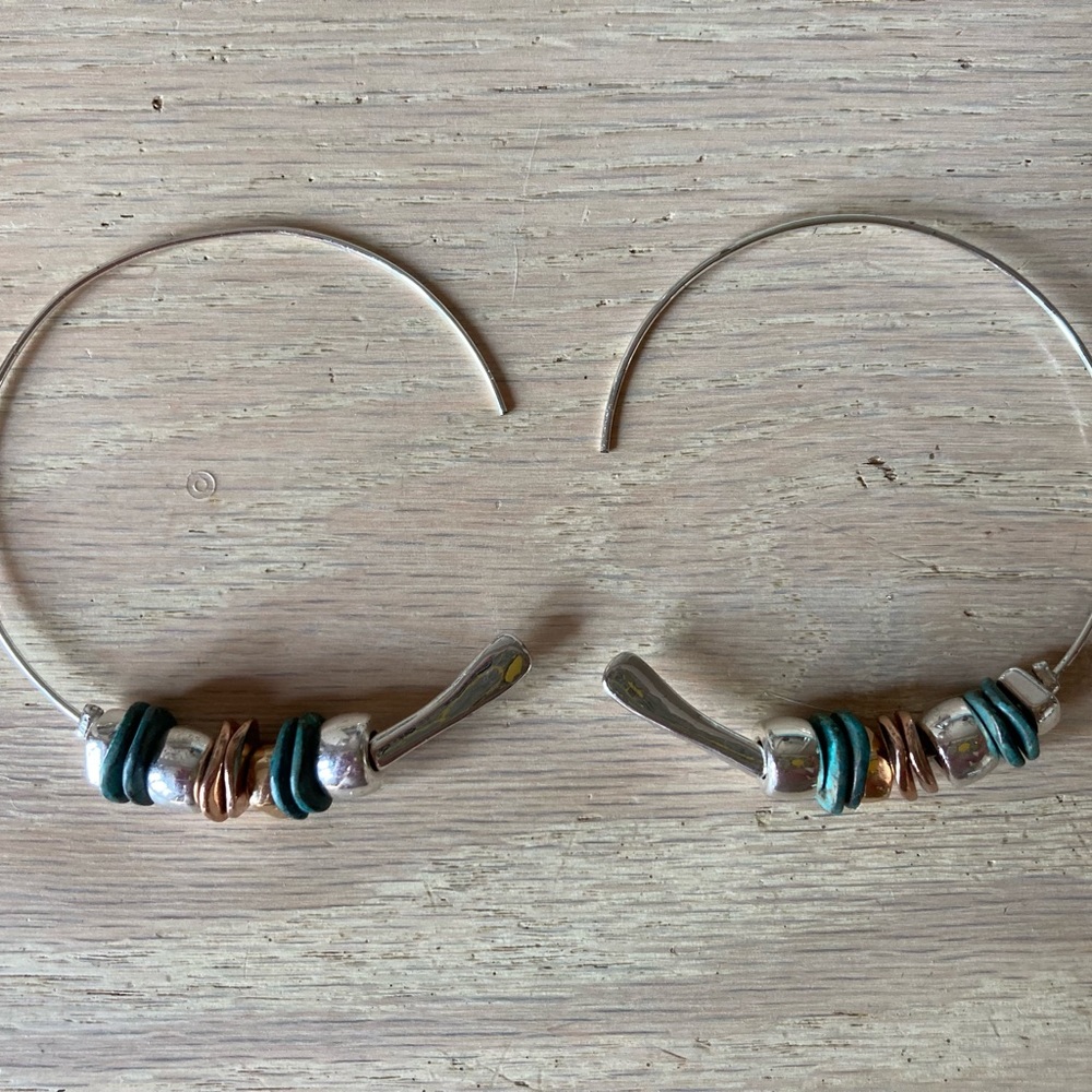 Large silver tone hoops with multi bead detail.